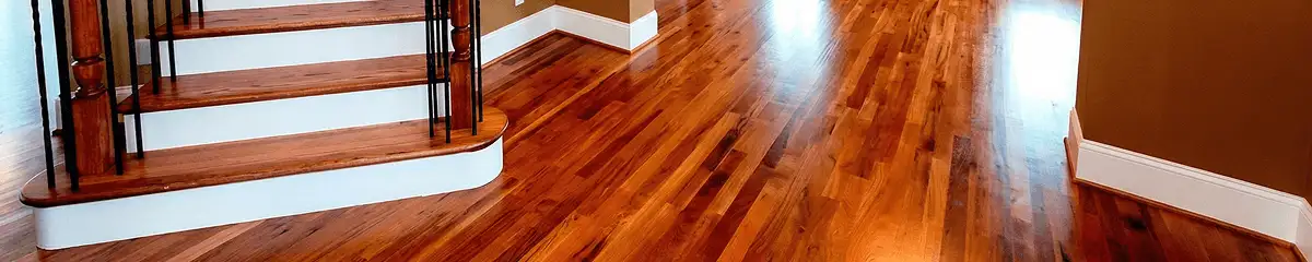 Base floor of a staircase with professionally restored wood flooring in Saint Louis MO