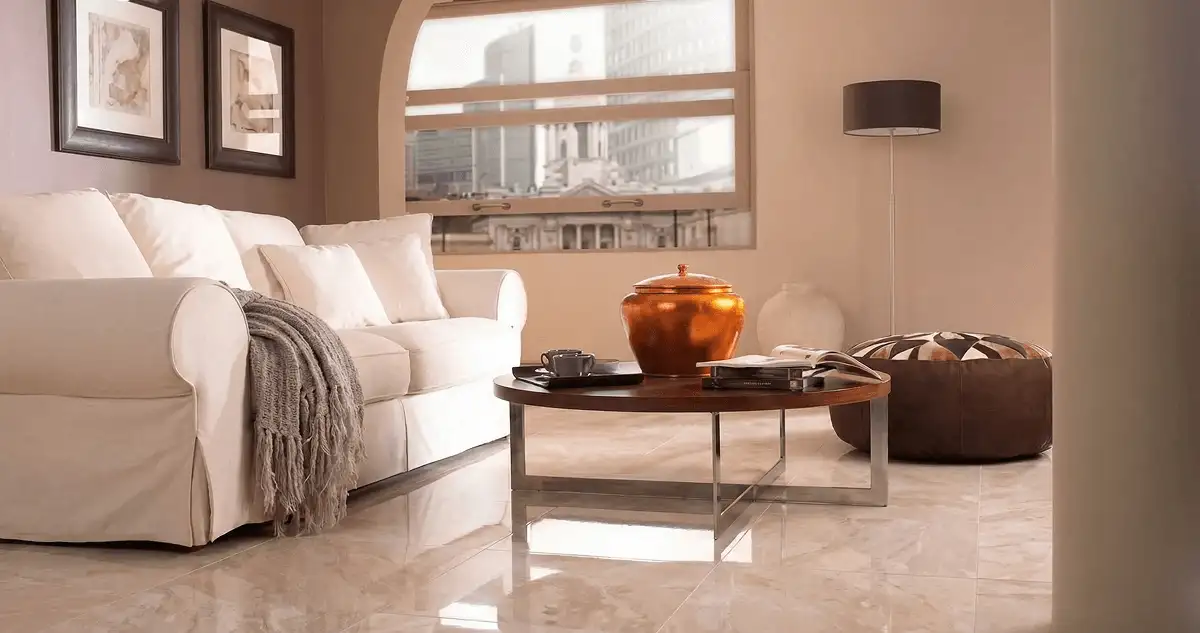 Modern living room with professionally installed marble flooring, a beige sofa, coffee table in Saint Louis, MO