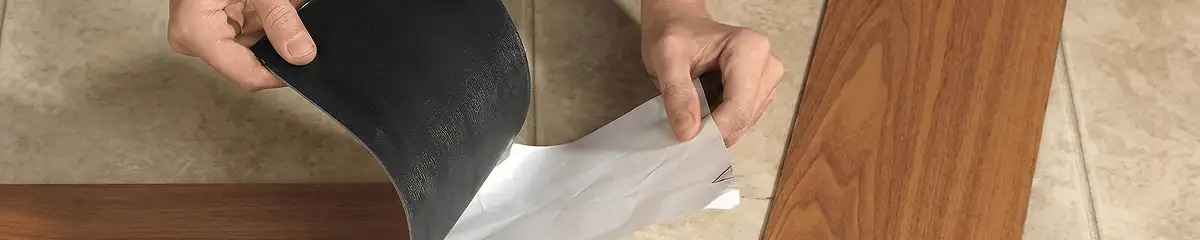 A professional installing vinyl flooring in Saint Louis, MO